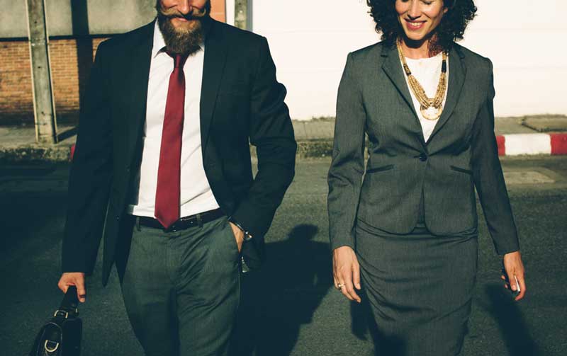 Man-and-Women-Walking-to-a-Business-Presentation